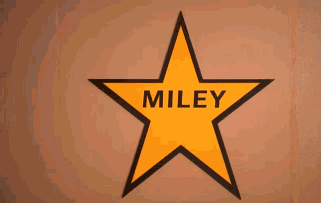 a star that says miley on it