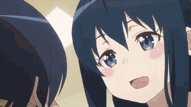 a girl with blue eyes is smiling and looking at a boy