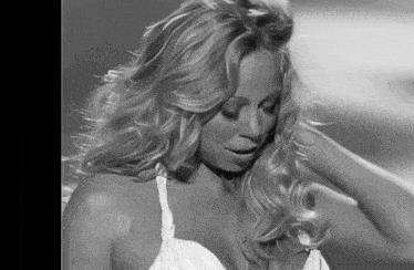 a black and white photo of a woman with long blonde hair