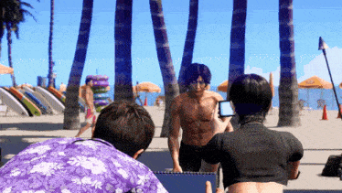 a man without a shirt is being photographed on the beach