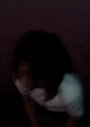 a blurry picture of a person with mek written on the bottom right