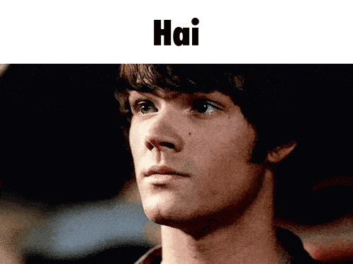 a close up of a man 's face with the word hai written above him