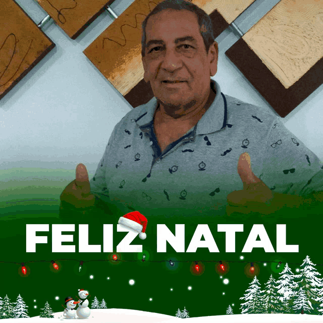a man wearing a santa hat gives a thumbs up in front of a feliz natal sign