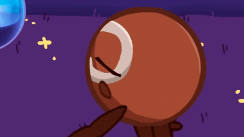 a cartoon drawing of a brown ball with a crescent moon on its face