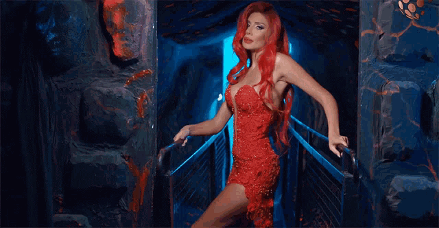 a woman with red hair and a red dress