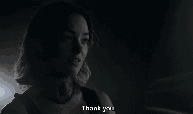 a woman with a collar around her neck is saying thank you