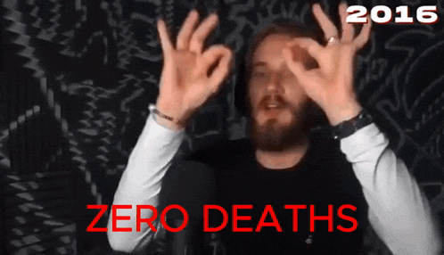 a man with a beard making an ok sign in front of a 2016 zero deaths sign