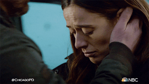 a man holds a woman 's ear in a chicagopd scene