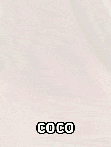 a blurry picture of a person 's face with the word coco on it