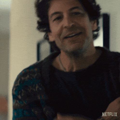 a man is smiling in a netflix advert