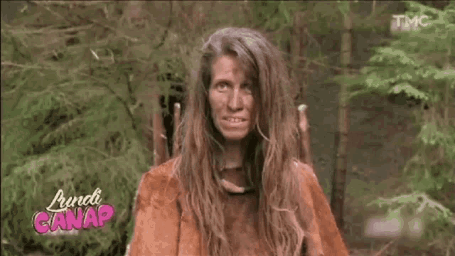 a woman with long hair is standing in a forest with the words lundi canap on the bottom left