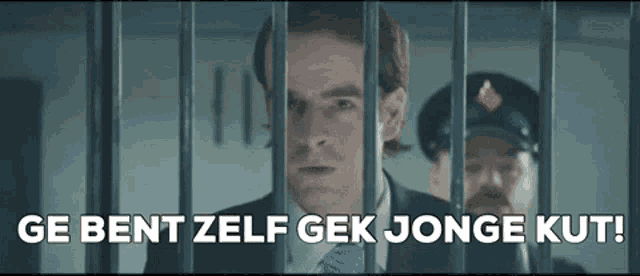 a man in a suit and tie behind bars with the words ge bent zelf gek jonge kut
