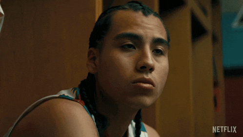 a basketball player says let 's bounce in front of a locker