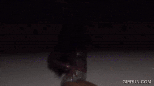 a gif from gifrun.com shows a woman in a white bikini