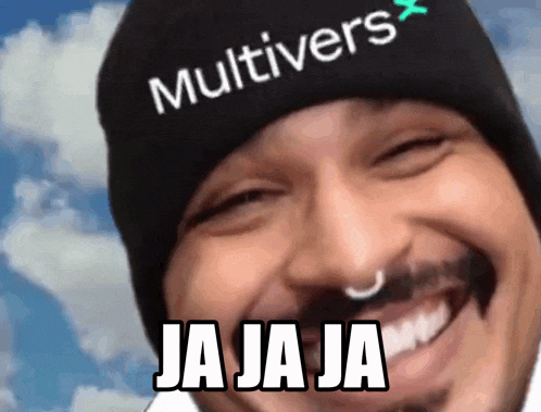 a man wearing a beanie that says multivers is smiling