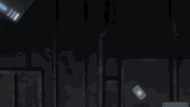 a projector is hanging from the ceiling in a dark room with two speakers