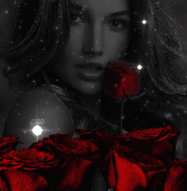 a black and white photo of a woman surrounded by red roses with a star in the background