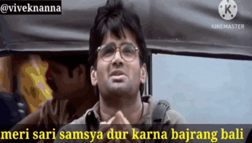 a man in a car with the words meri sari samsya dur karna bajrang bali written below him
