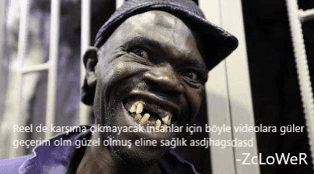 a man with a hat on is smiling with a quote on the bottom .