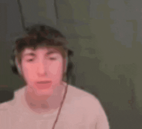 a blurry photo of a man wearing headphones