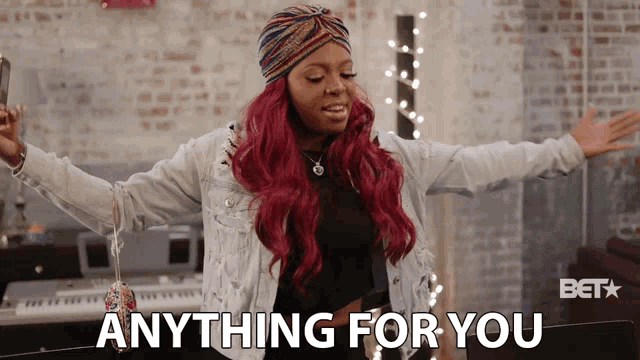 a woman with red hair says anything for you in front of a keyboard