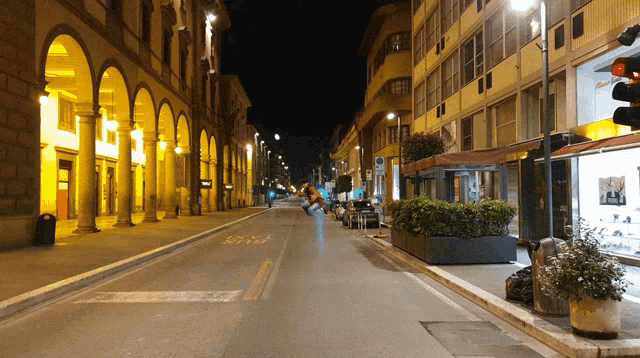 an empty street at night with a sign that says ' sss '