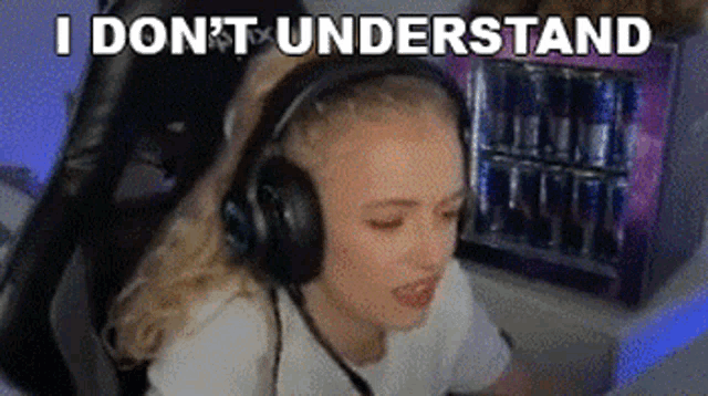a woman wearing headphones is sitting in front of a computer screen .