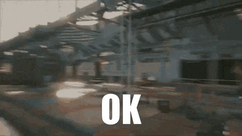 a blurred image of a building with the word ok in white letters