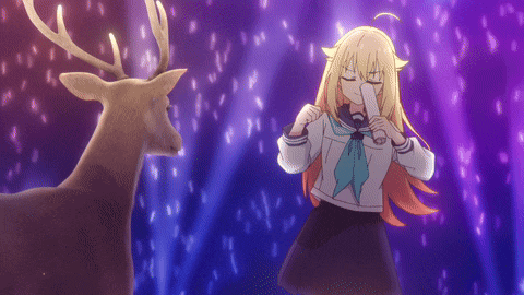 a girl is standing next to a deer with antlers