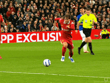 a soccer game is being played in front of a large pp exclusive sign