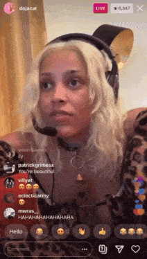 a woman wearing headphones and a microphone on a live stream