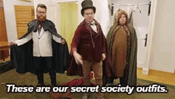 a group of people dressed in costumes with the caption these are our secret society outfits .