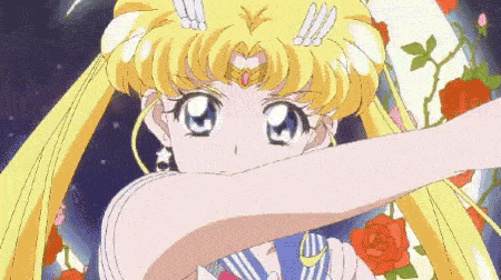 a close up of a cartoon character with a crown on her head .