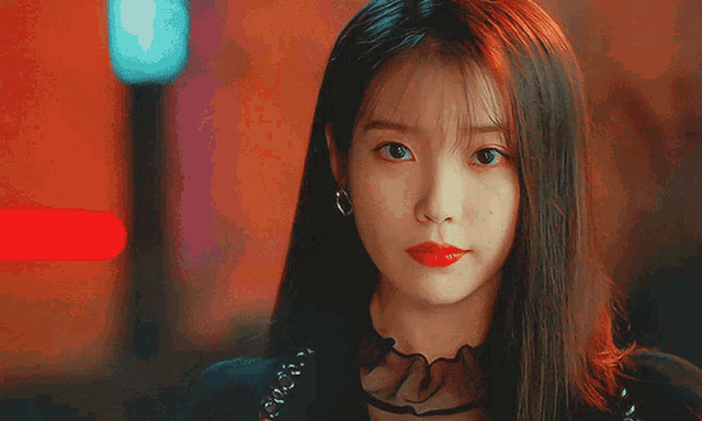 a close up of a woman with red lipstick on her lips