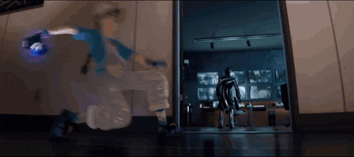 a person in a wheelchair is standing in a doorway