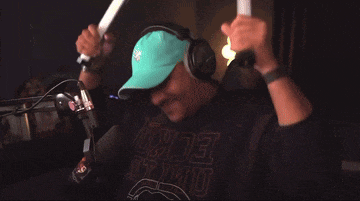 a man wearing headphones and a shirt that says ecru on it