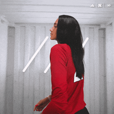 a woman in a red shirt with the number 4 on it