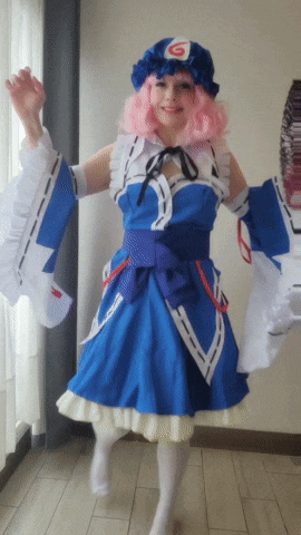 a woman in a blue and white costume with a hat that has the number 6 on it