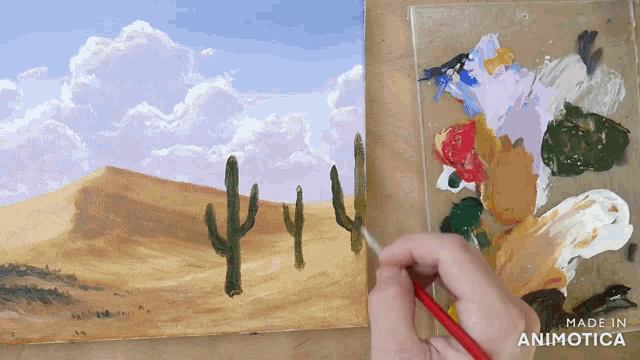 a person is painting a cactus in the desert with the words made in animotica below it