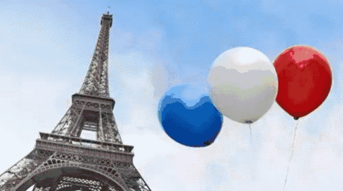 three balloons are flying in front of the eiffel tower in paris