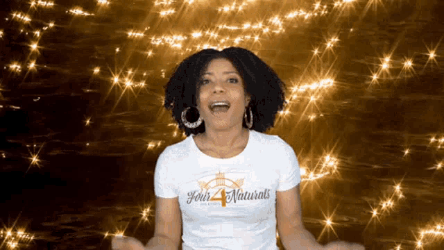 a woman wearing a shirt that says john 's 4 naturals