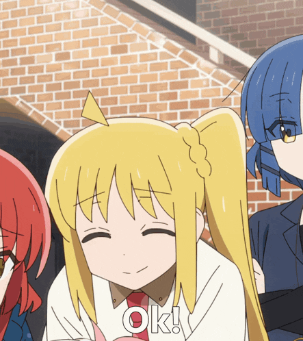 a cartoon girl with blonde hair is smiling with the word ok below her