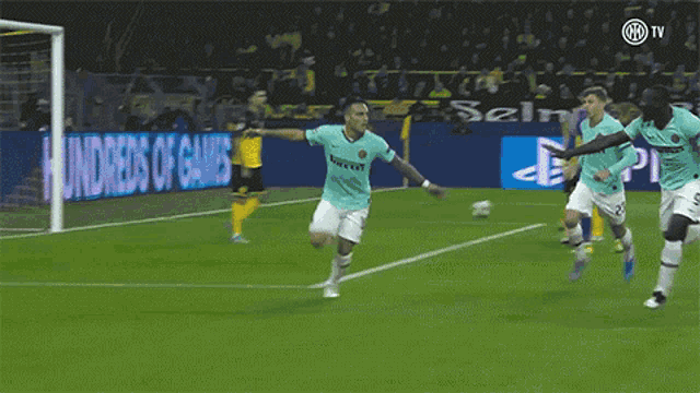 a soccer player is kneeling on the field in front of an on demand banner