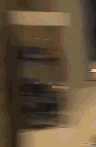 a blurry picture of a person standing in a room