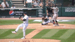 a pepsi ad is on the wall behind a baseball field