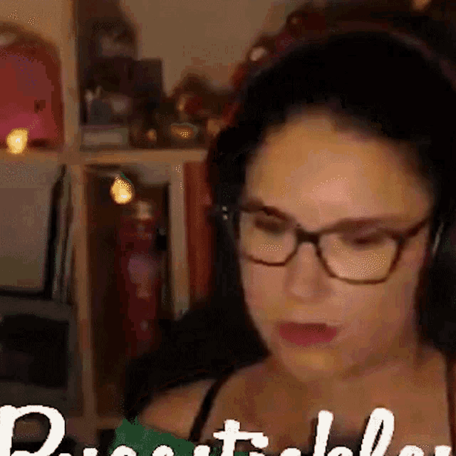 a woman wearing glasses and headphones has the word possible written on her face .