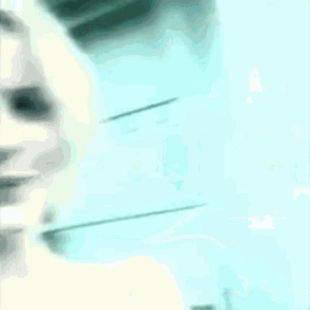 a close up of a woman 's face against a blue background .