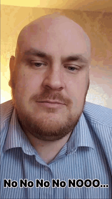 a bald man with a beard is wearing a striped shirt and says " no no no no nooo "