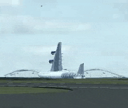 a plane is taking off from an airport runway .