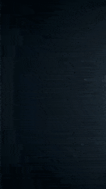 a sphere of water is being poured into a glass container .